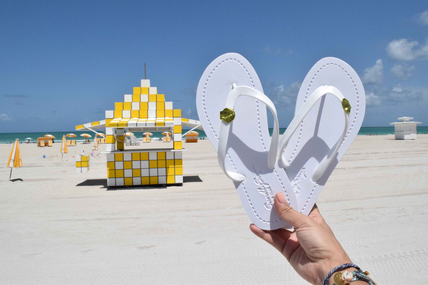 Gold Shell Charm Flip-Flop Sandals | The Sophisticated Shoppers
